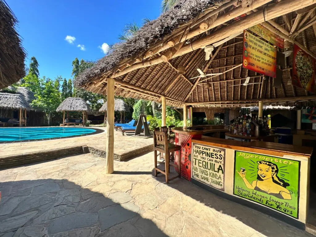 Common area and pool at Diani Backpackers Hostel
